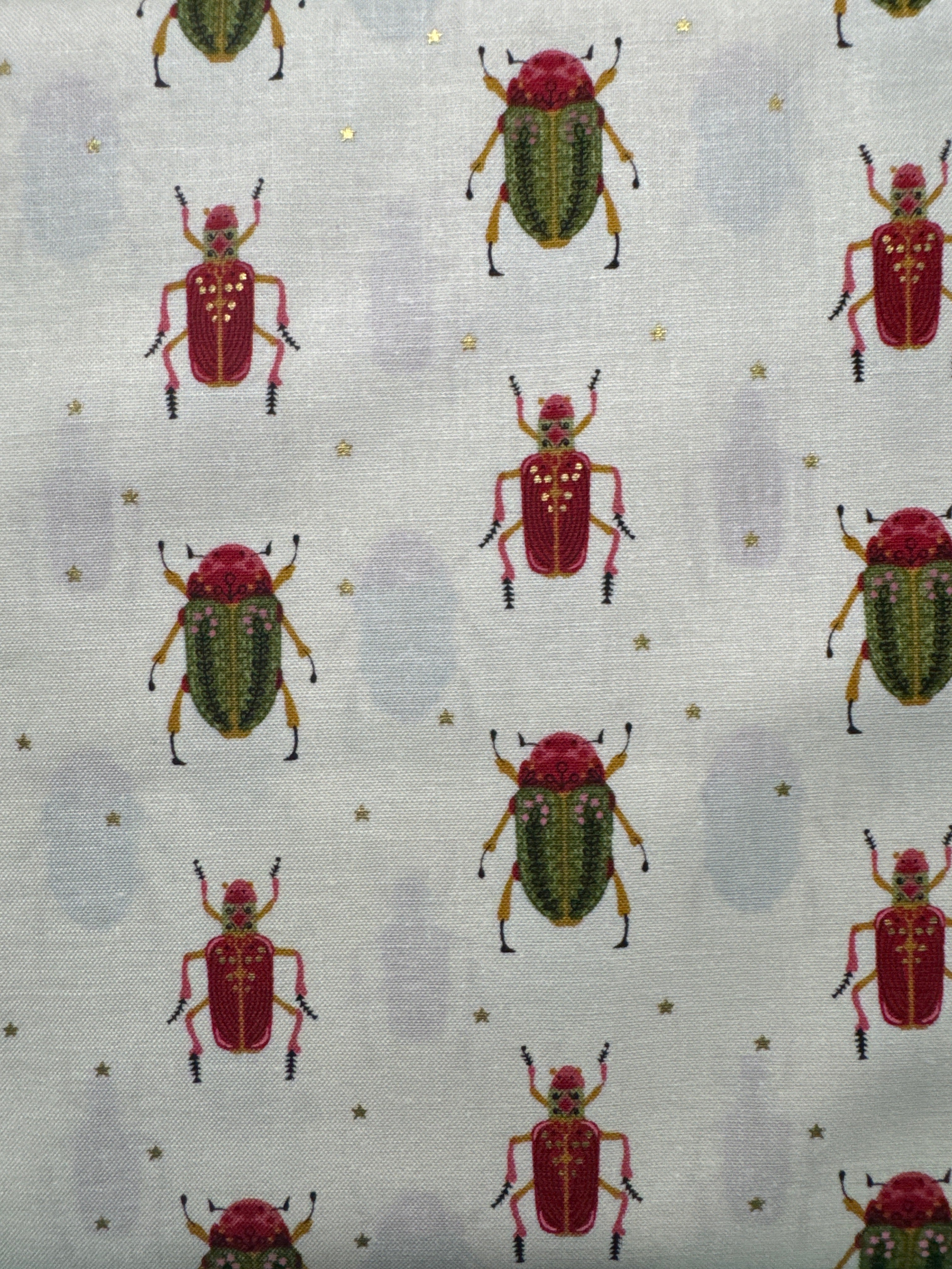 Bird Humbug. Bettles on a cream background. Sold by the half yard.