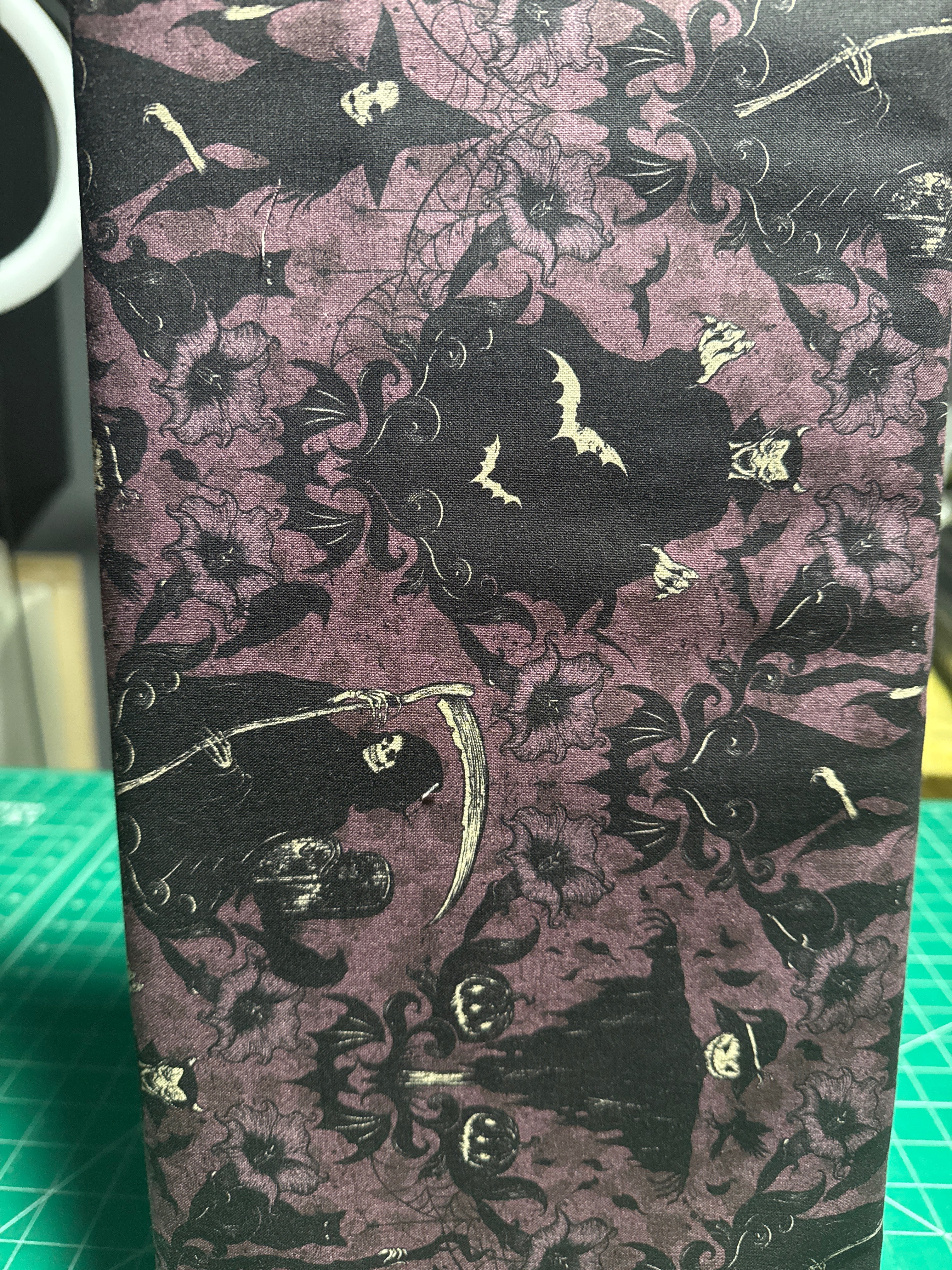 Darkly Enchanted. Damask with Witch, scarecrow, and grim reaper. Sold by the half yard
