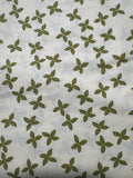 Bird Humbug. Green Poinsettias. Sold by the half yard.