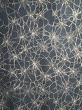Witchypoo. Tan spiderwebs on a black background. Sold by the half yard. ￼