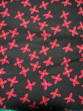 Bird Humbug. Poinsettias on black background. Sold by the half yard.