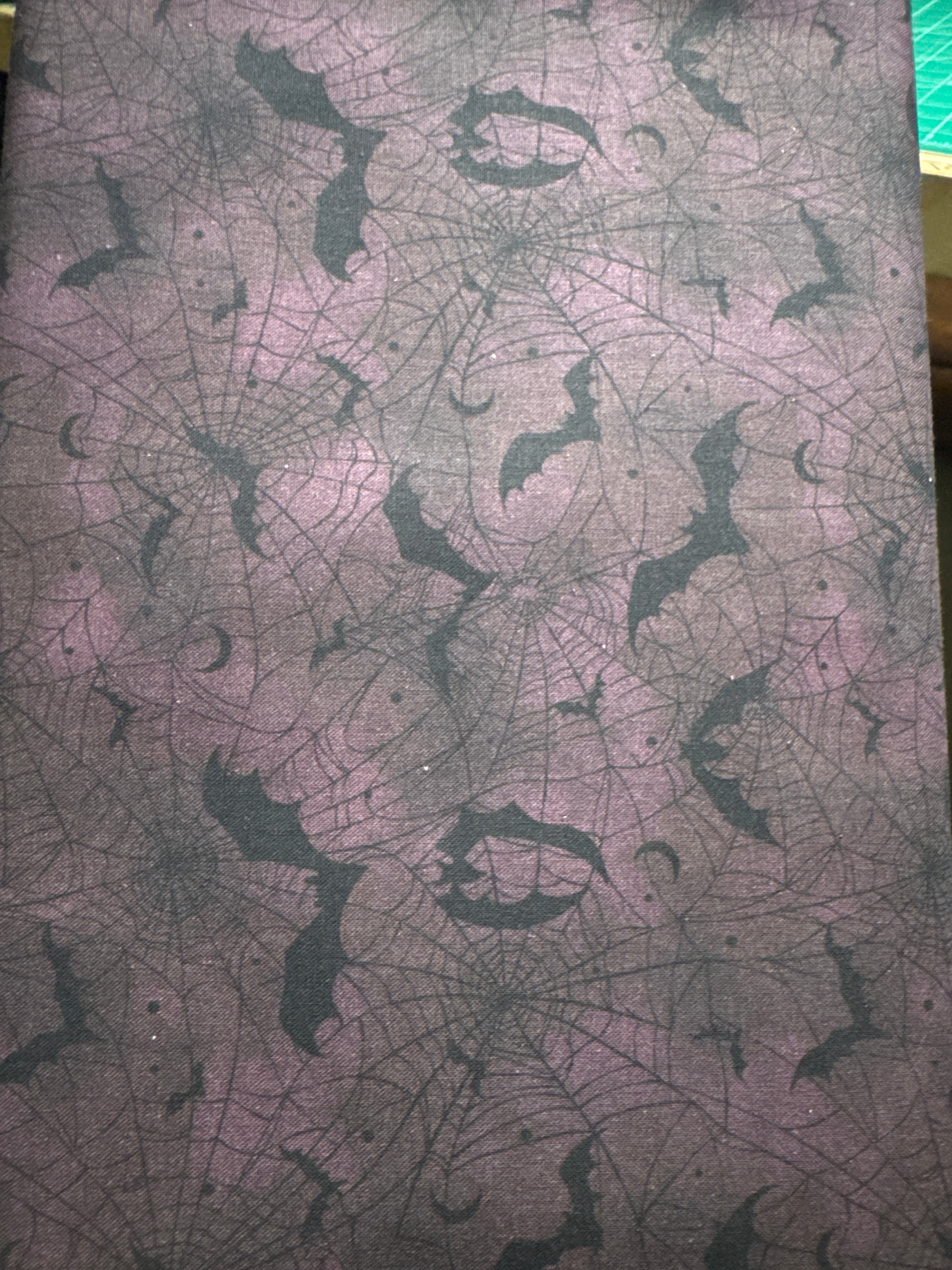 Darkly Enchanted. Bats and cobwebs. Sold by the half yard.