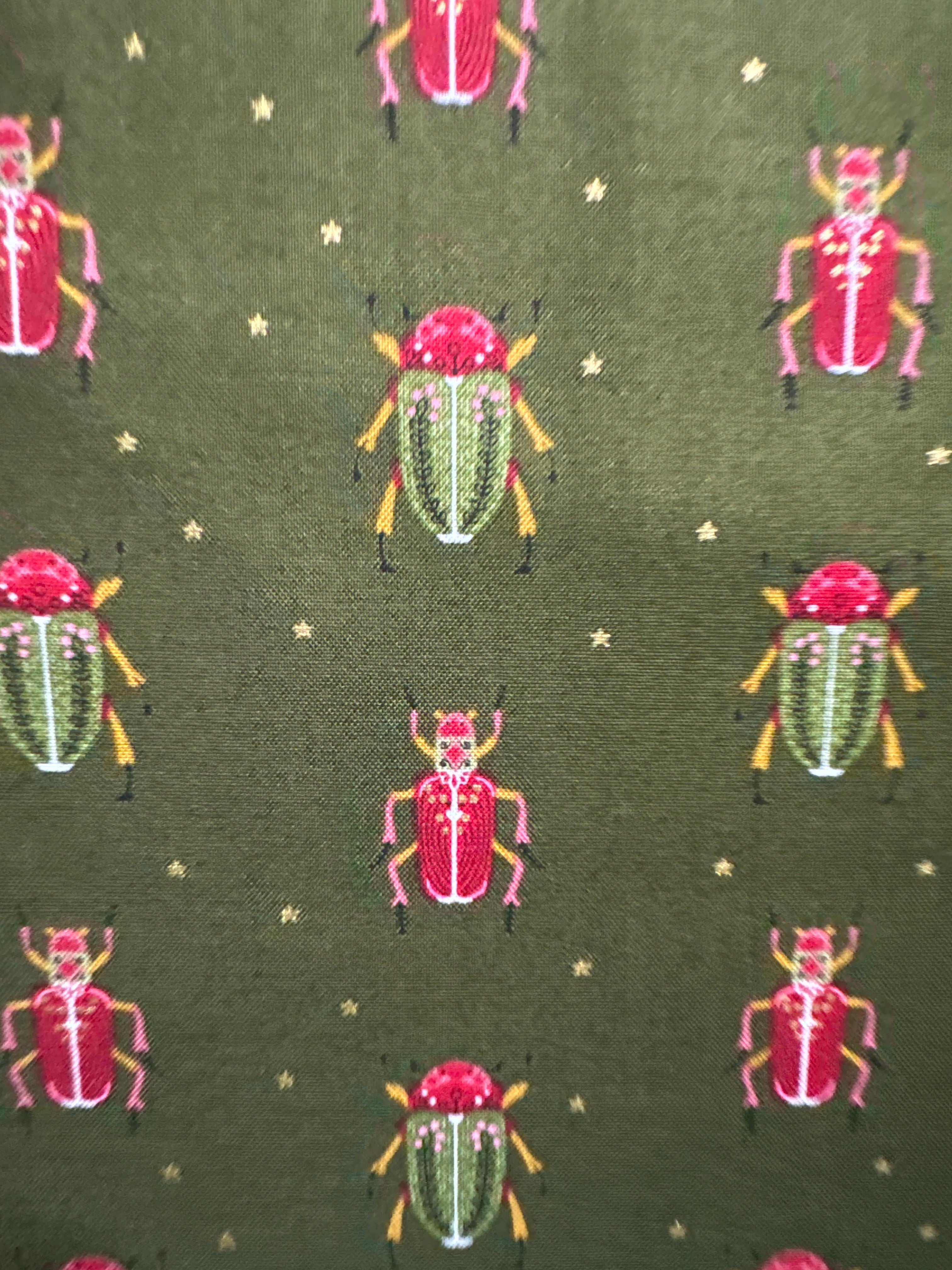 Bird Humbug. Bugs on a green background. Sold by the half yard.