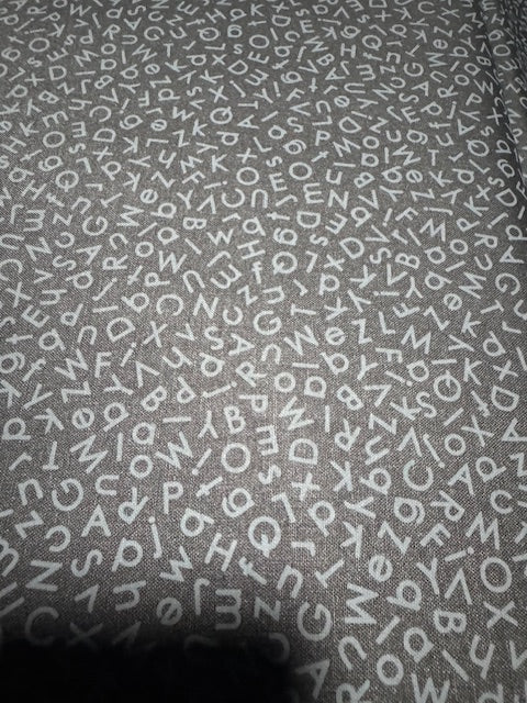 Quilting Illusions. Letters. Black on black. Sold by the HALF  yard QT Fabrics